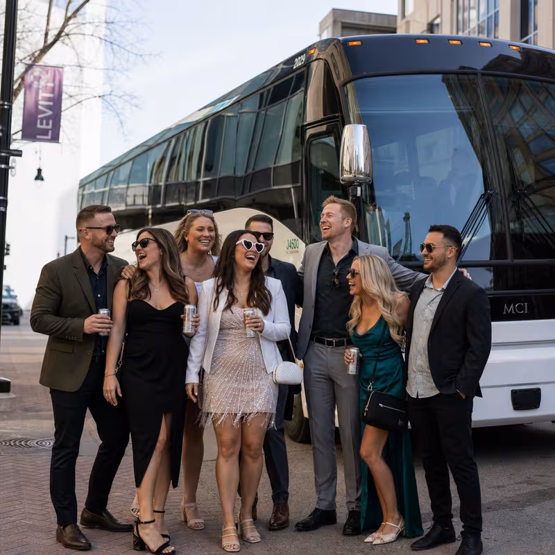 Passengers loading luggage while boarding an Sioux Falls group shuttle