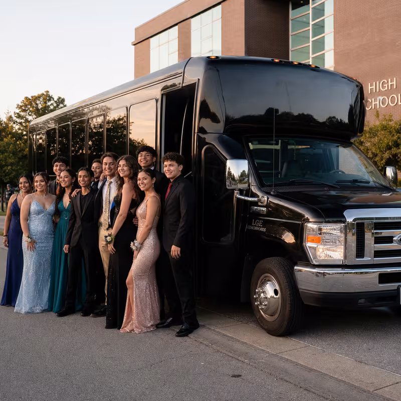 Group boarding a white charter bus for Prom & Homecoming Transportation transportation in Sioux Falls