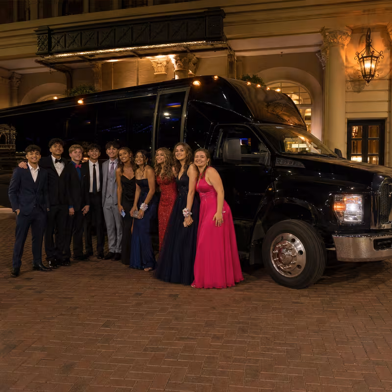 Party bus interior with wraparound leather seating and LED lighting in Sioux Falls