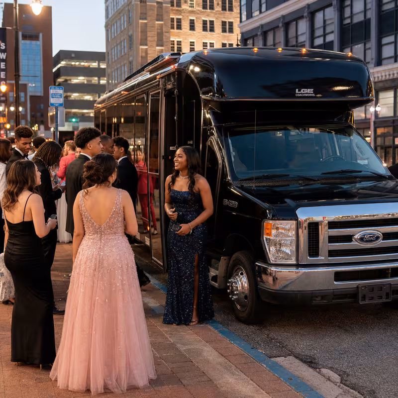 Passengers loading luggage while boarding an Sioux Falls group shuttle