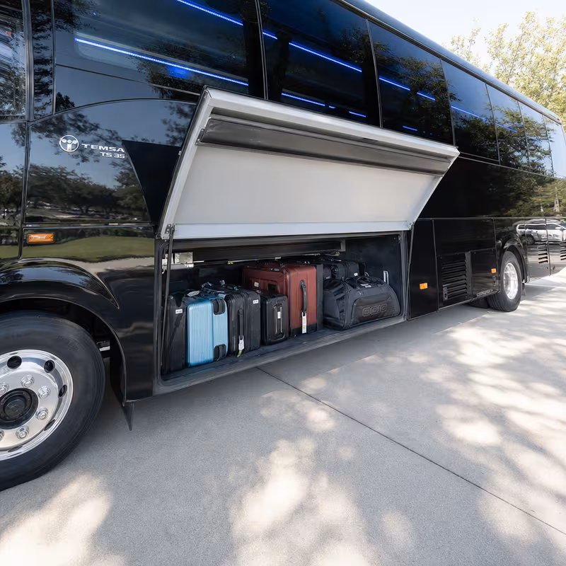Party bus interior with wraparound leather seating and LED lighting in Sioux Falls