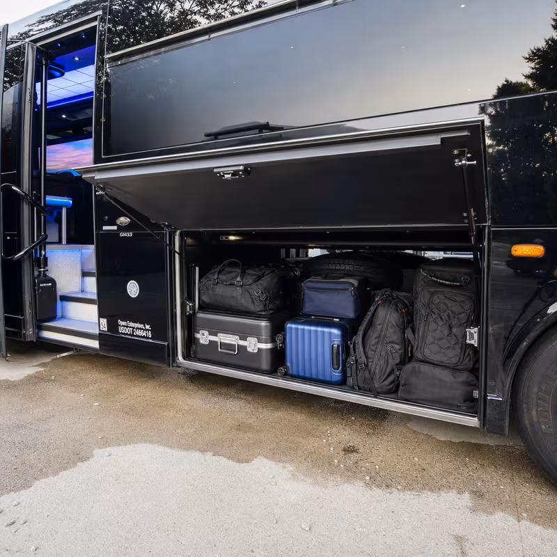 Party bus interior with wraparound leather seating and LED lighting in Sioux Falls