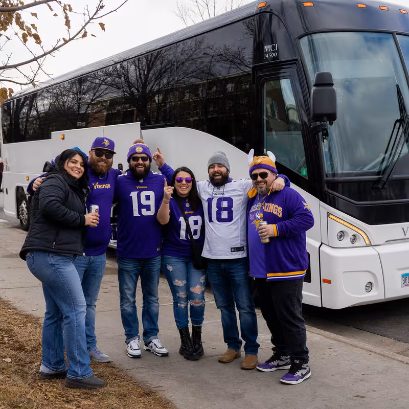 Passengers loading luggage while boarding an Sioux Falls group shuttle