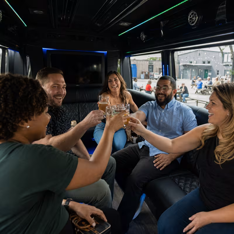 Group boarding a white charter bus for Winery & Brewery Tour Transportation transportation in Sioux Falls