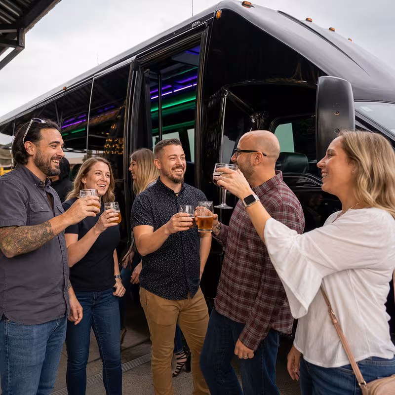 Passengers loading luggage while boarding an Sioux Falls group shuttle